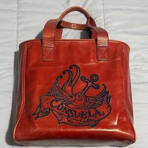 Consuela Red Leather Bag with Black Design